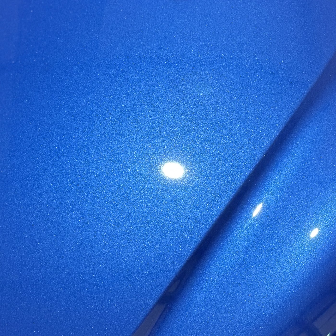 Audi R8 quarter panel after a two stage correction, the light a clean point